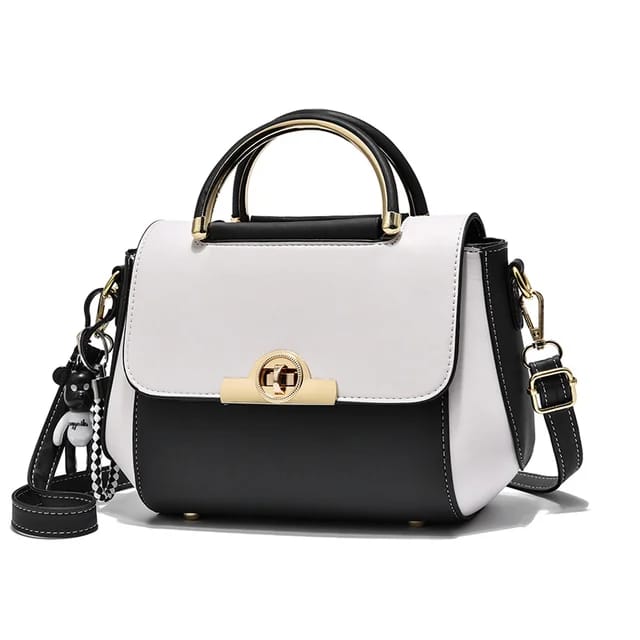 A small classy bag, with a gold buckle. The bag is black.